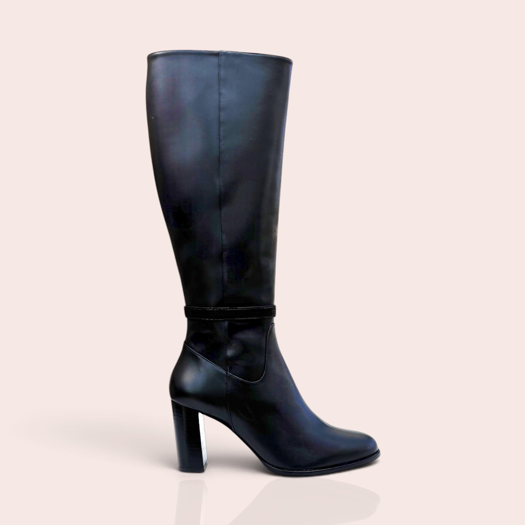 Smooth black leather knee-high boots with a sturdy block heel and a refined ankle strap detail.