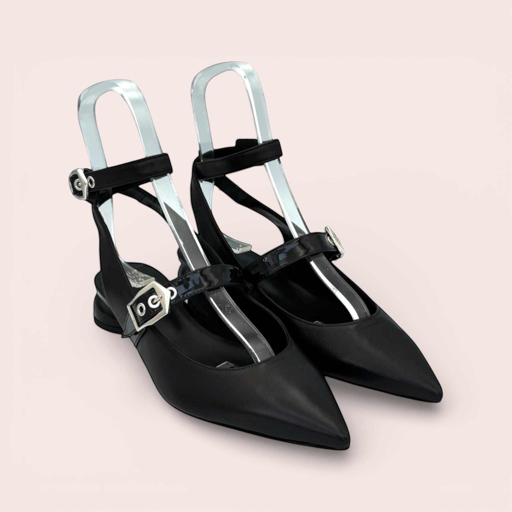 Black leather slingback sandals with pointed toe, two silver buckle straps, and a sculpted black heel. Features a slingback design and polished finish.