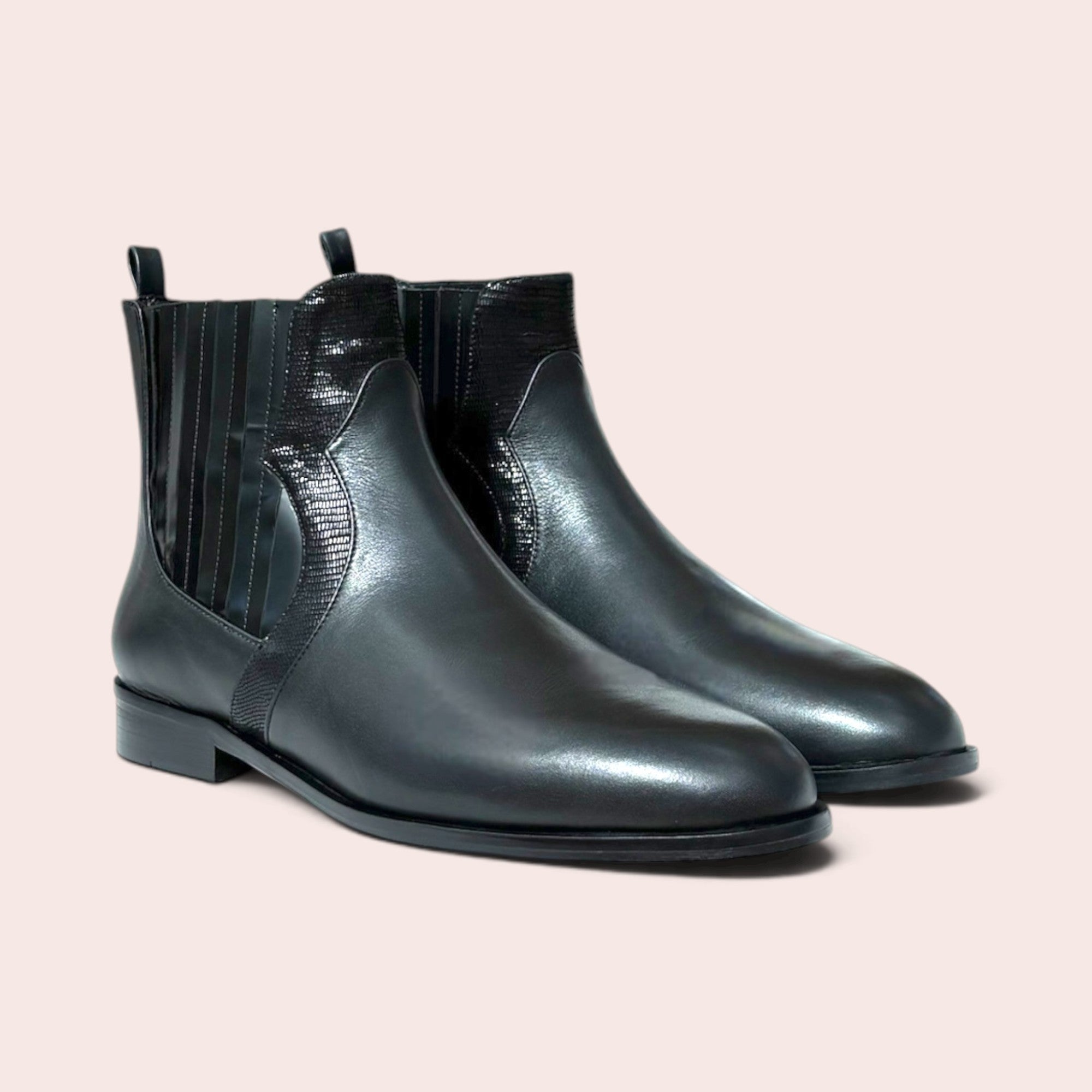 Karine Arabian black leather Chelsea ankle boots with textured side gussets, low heel, and rear pull tab.
