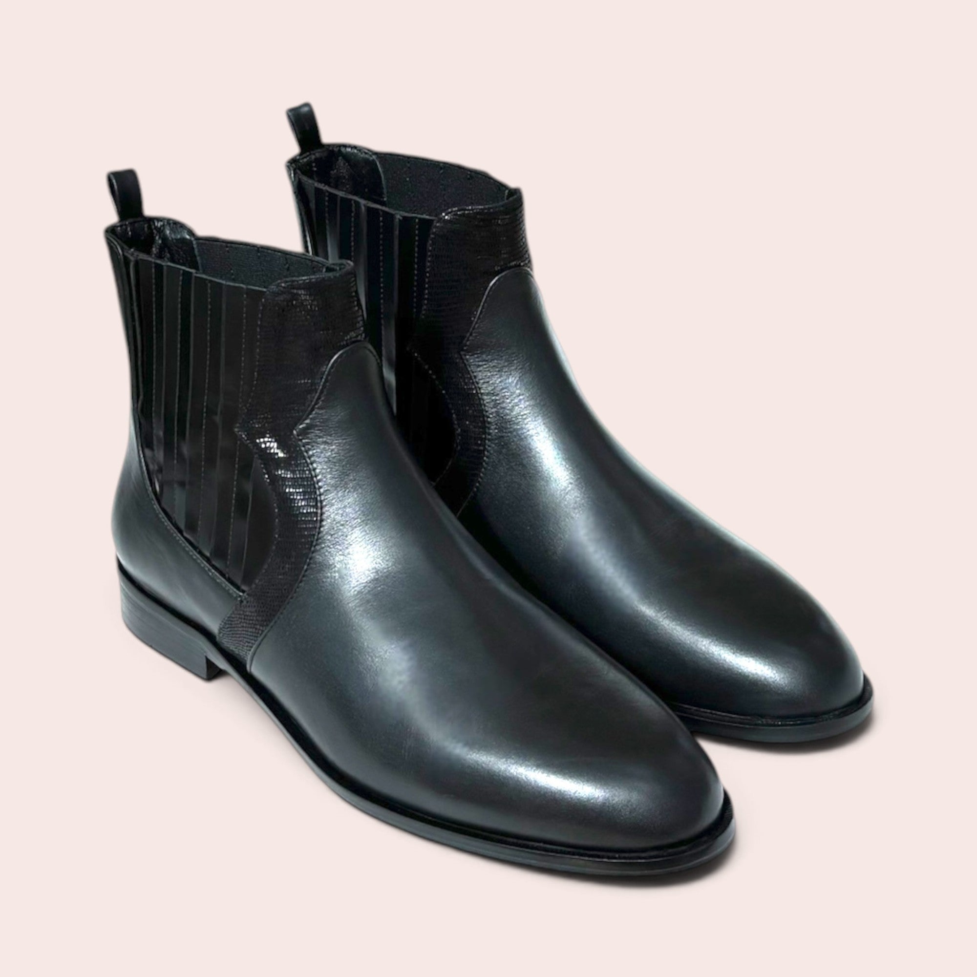 Karine Arabian black leather Chelsea boots with textured elastic side panels and a low-profile heel.