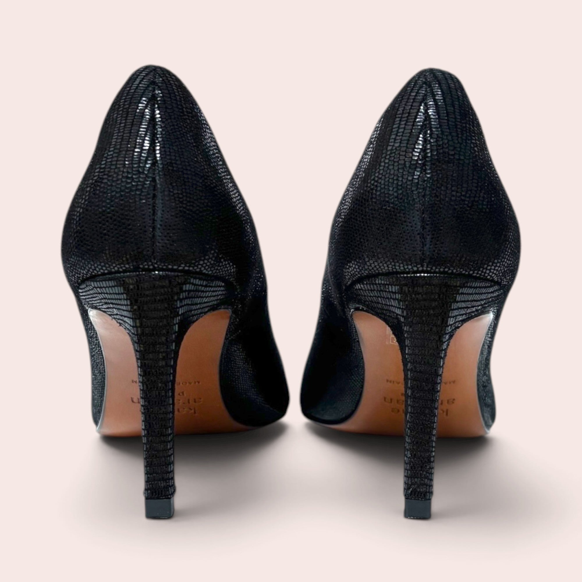 Back view of Karine Arabian black stiletto pumps with a textured exotic leather finish and slim high heels.