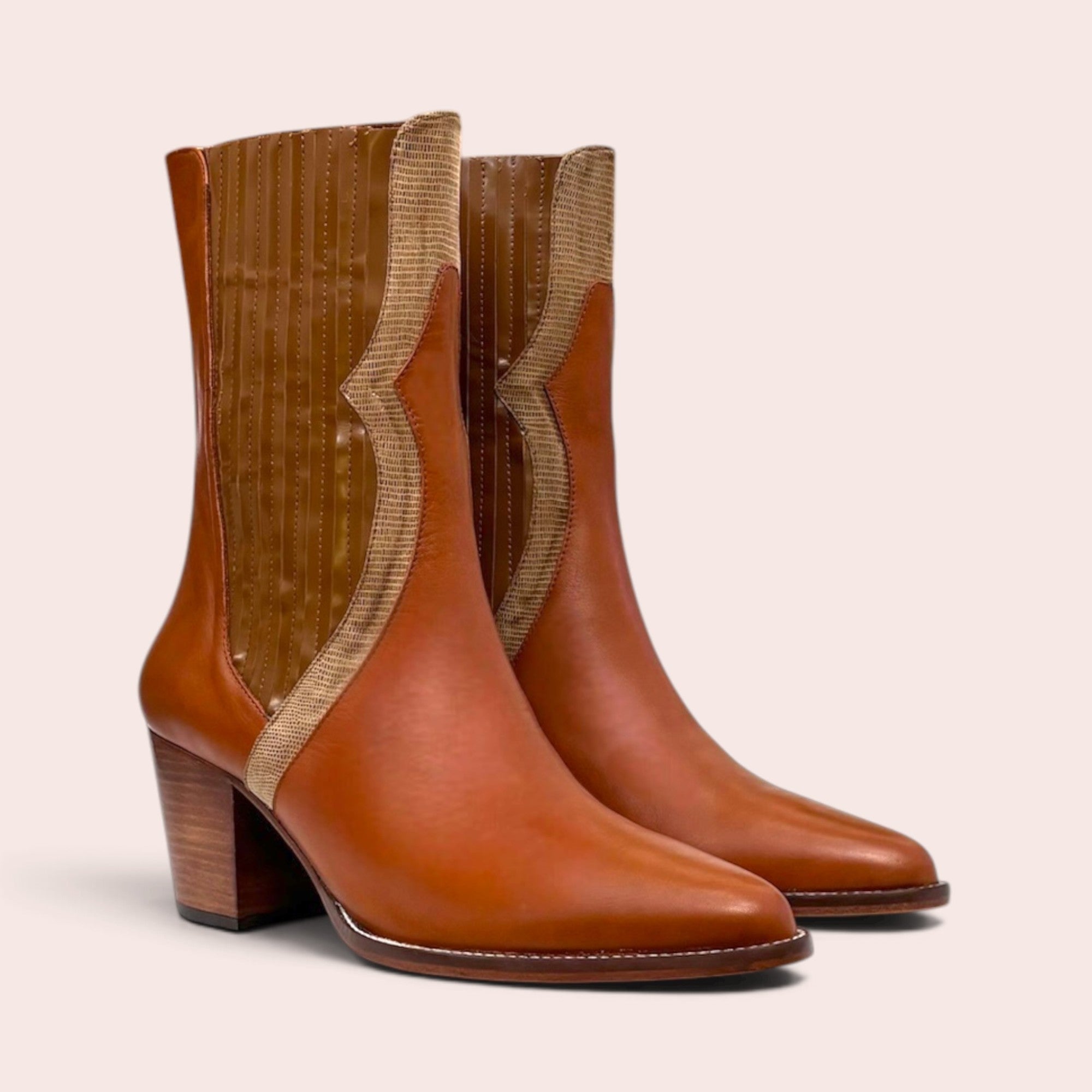 Tan leather mid-calf boots with a pointed toe, stacked block heel, and snake-embossed textured side paneling.