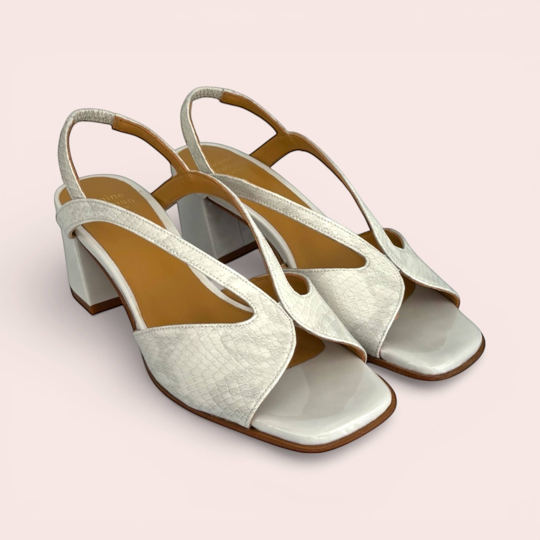 White leather slingback sandals with a textured snakeskin finish on the straps and a glossy patent toe.