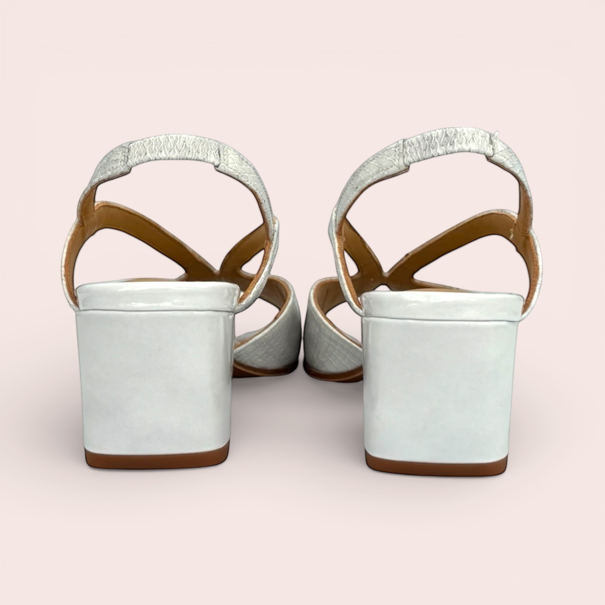 White Yolanda sandals with a textured snakeskin-effect finish on the straps and a chunky block heel.