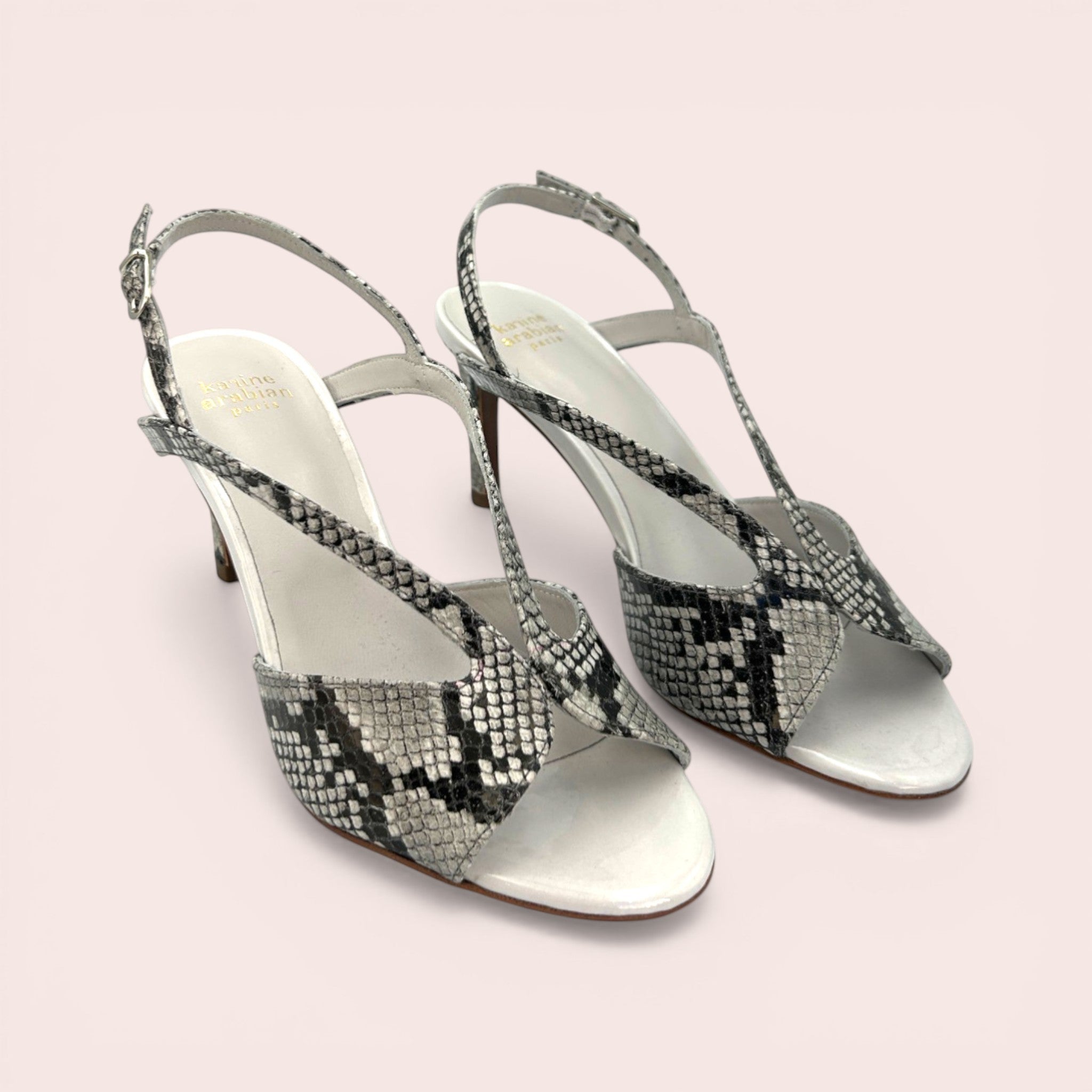 Taupe, white, and black python print leather slingback sandals with a pointed toe and 65mm stiletto heel.